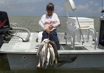 Doug Sauter 6yrs. old, first saltwater trip (with Dad and Grandpa) wade-fishing. Caught his limit of Trout and 1 Redfish - August